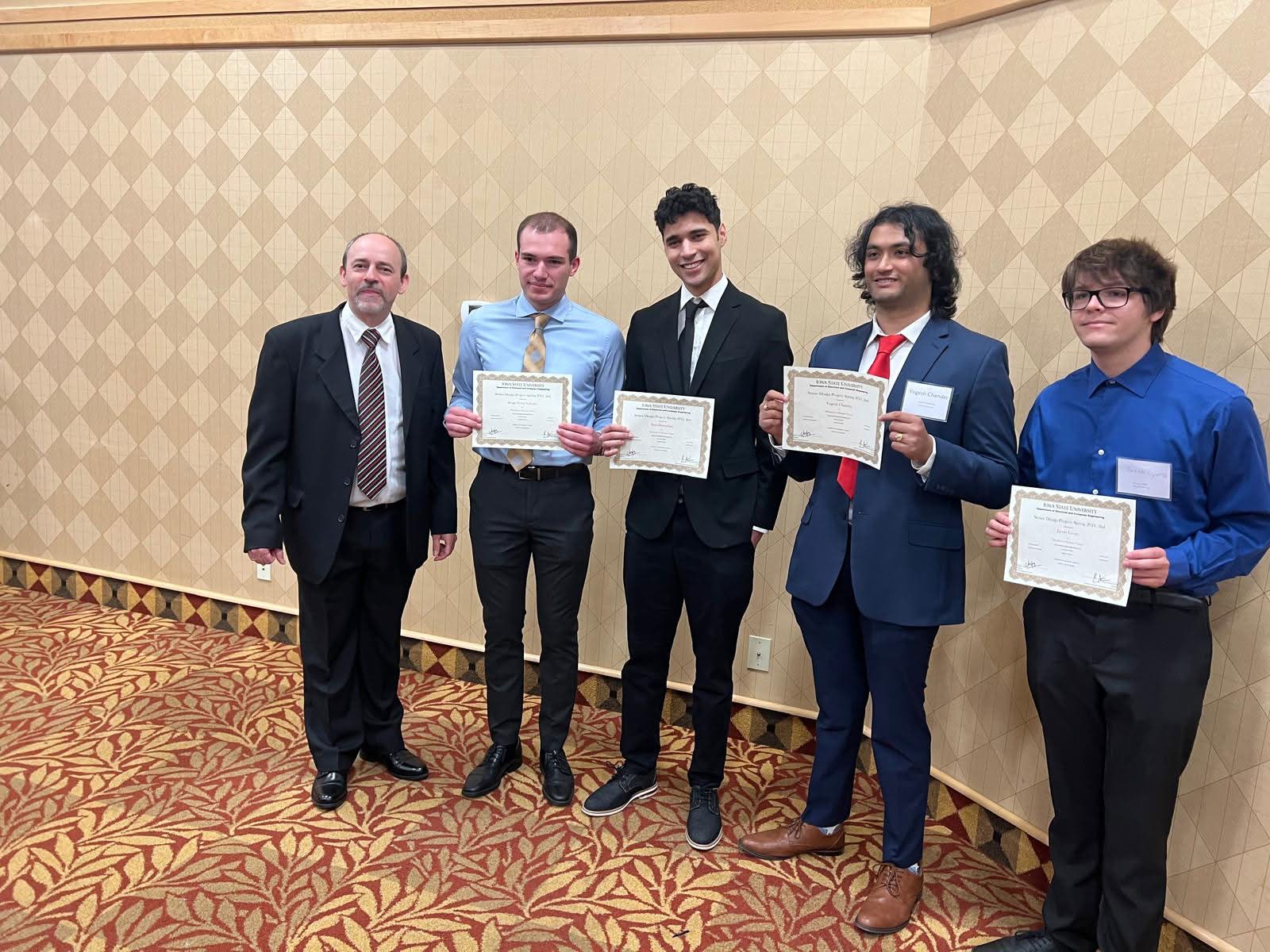 Machine to Human Vision team receiving the 2024 Senior Design Project class award