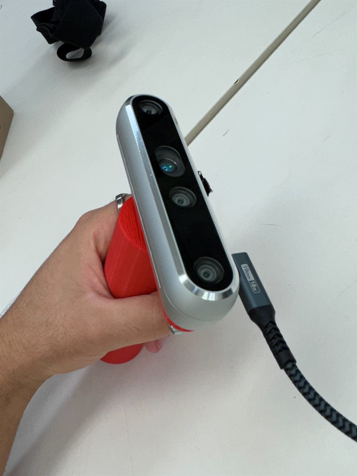 Intel RealSense depth camera held in its 3D-printed grip
